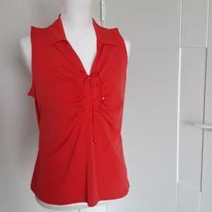 V neck sleeveless top with laced detail.
